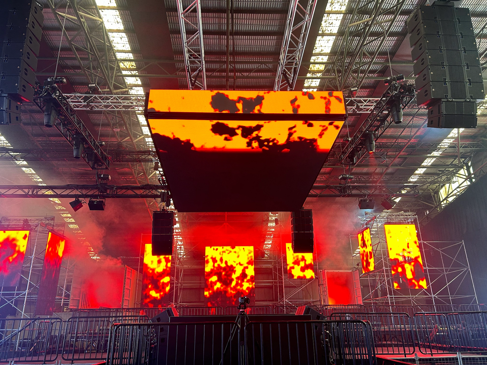 Indoor LED screen wall installation suspended from truss at live event