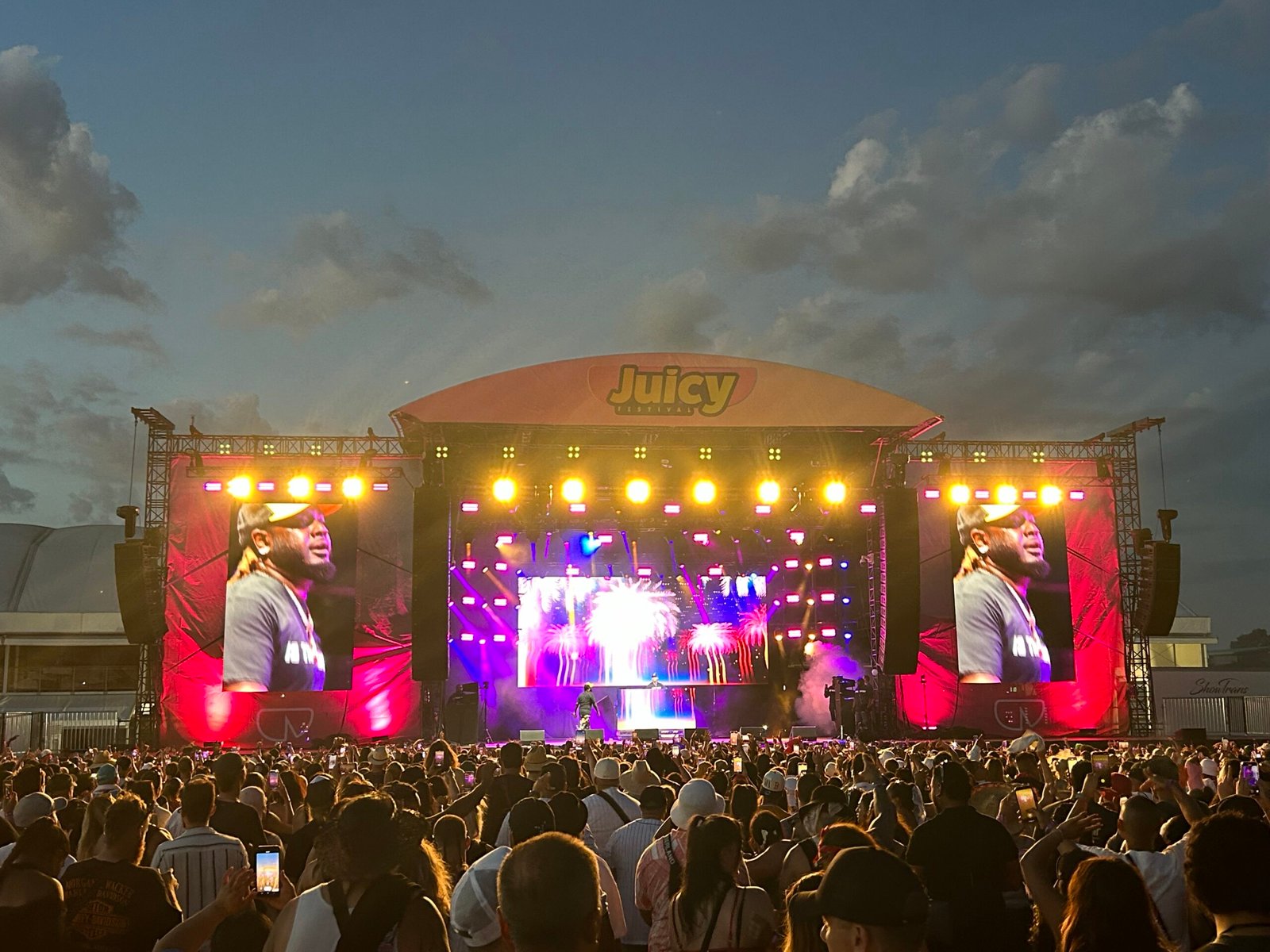 Outdoor music festival stage lighting and LED screens at Juicy Festival